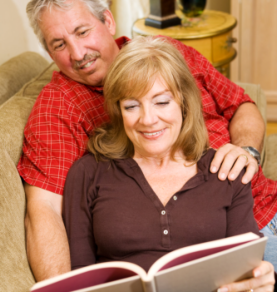 Elder couple reading book