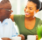 elder man and staff smiling