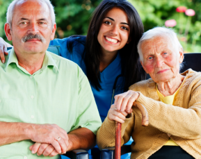 Smiling female staff elder couple